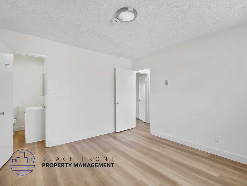 A room with a logo of Beach Front Property Management.