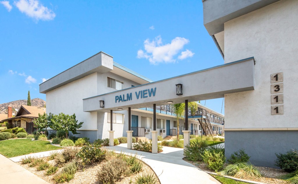 a white building with a sign that reads rain view
