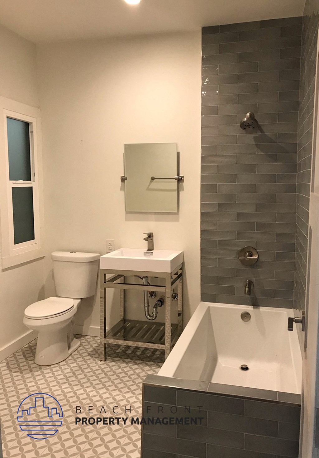 a bathroom with a toilet and a tub and a sink