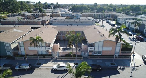 an aerial view of a building in a parking lot