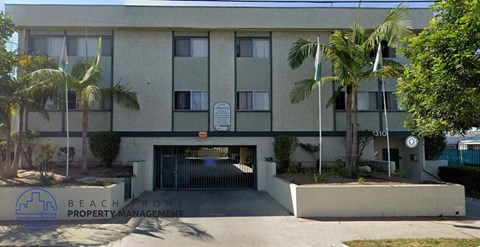 A building with a sign that says Beachfront Property Management.
