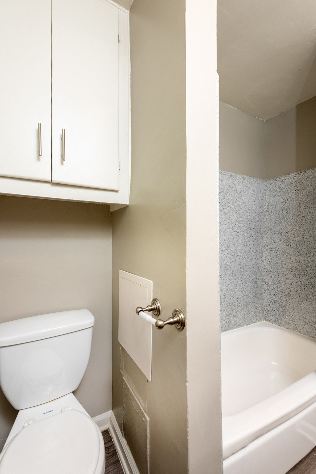 an empty bathroom with a toilet and a sink