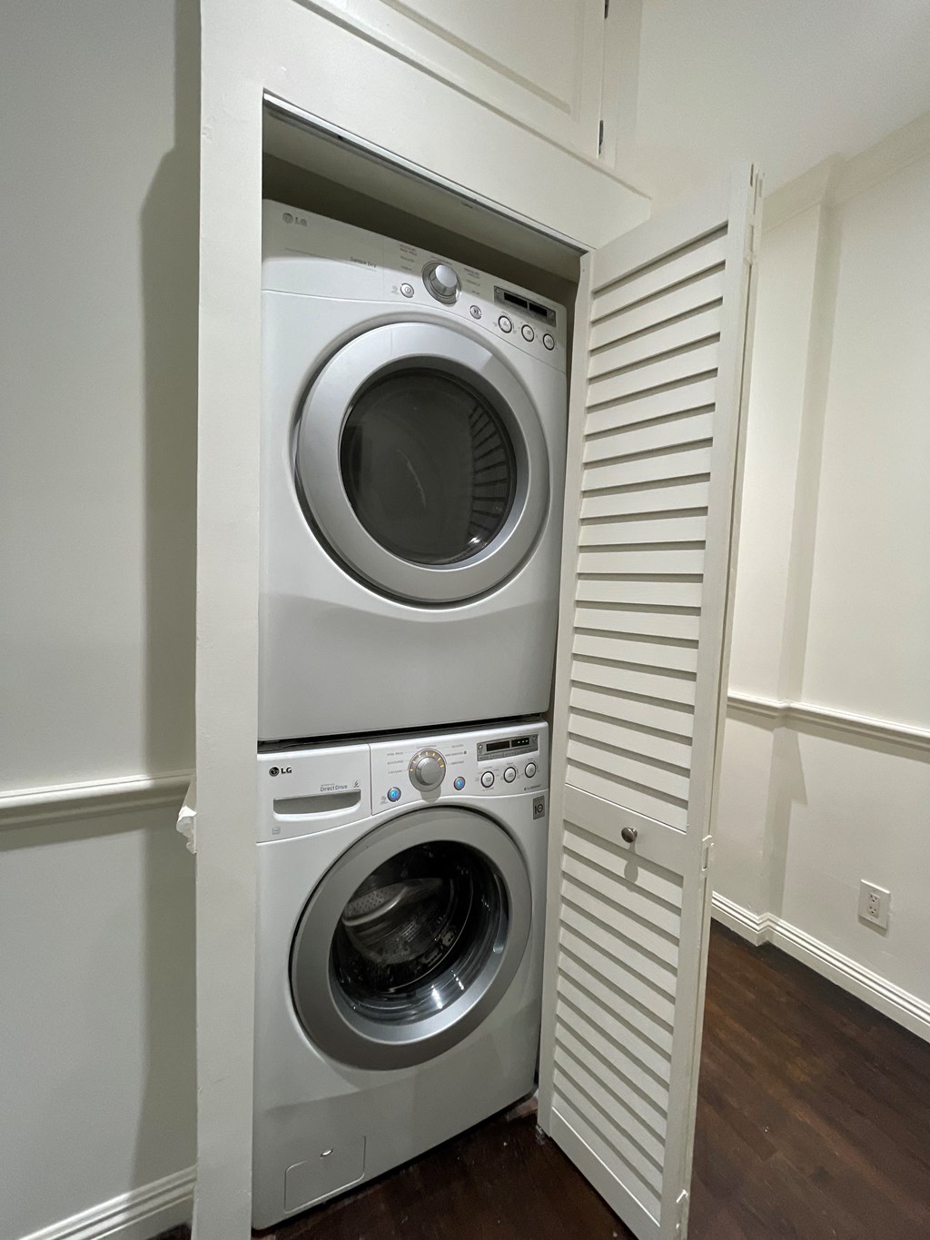 a built in washer and dryer in a laundry room