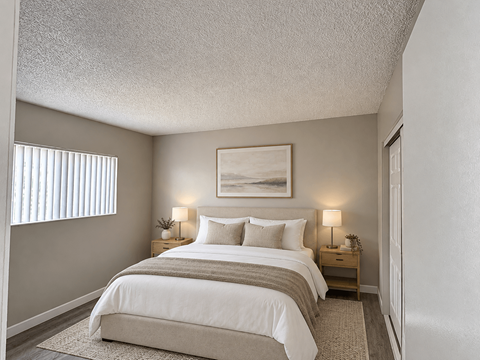 A bedroom with a large bed and a painting above it.