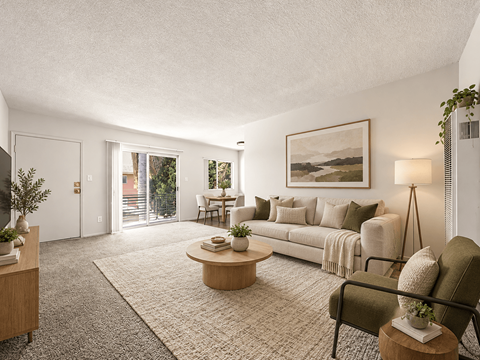 A living room with a couch, coffee table, and a painting on the wall.