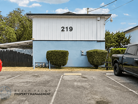 A white building with the number 219 on it.