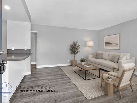 A living room with a couch, chair, and coffee table.
