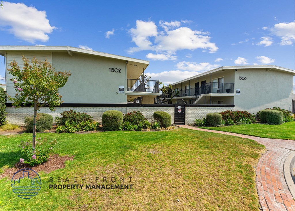 an image of a house with a yard in front of it
