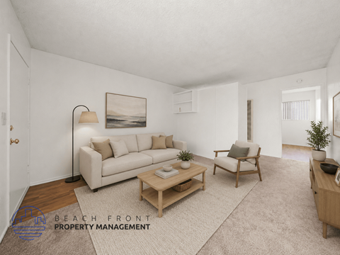 A living room with a couch, chair, and coffee table.