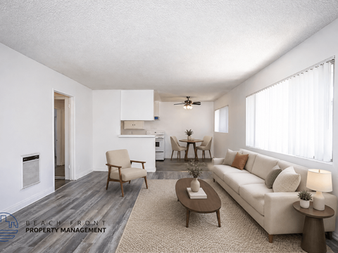 A living room with a couch, chairs, and a coffee table.