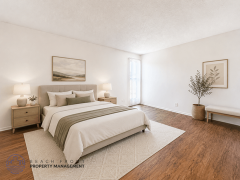 A well-lit bedroom with a large bed and a small tree.