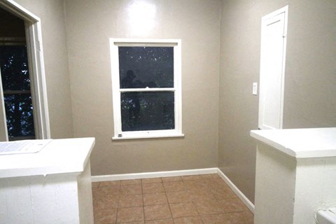 a bathroom with two counters and a window