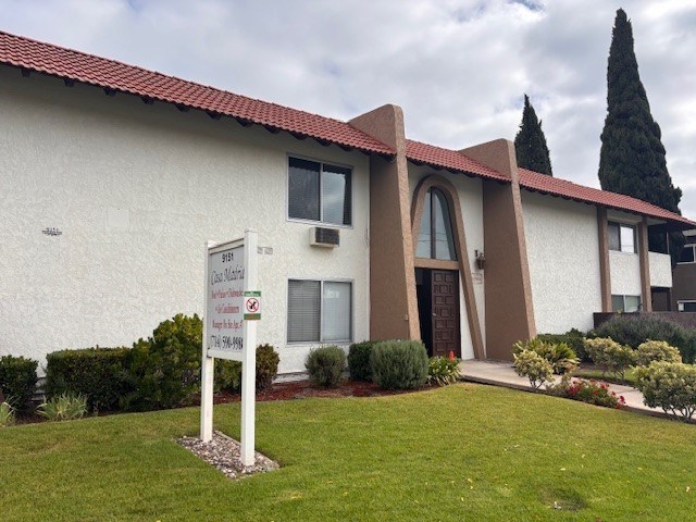 A building with a sign in front of it that says "Good Shepherd".