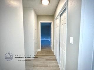 a hallway with a door to the ocean