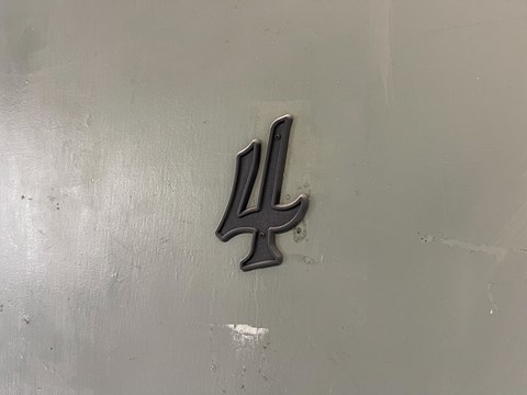 a silver door with the number 4 on it
