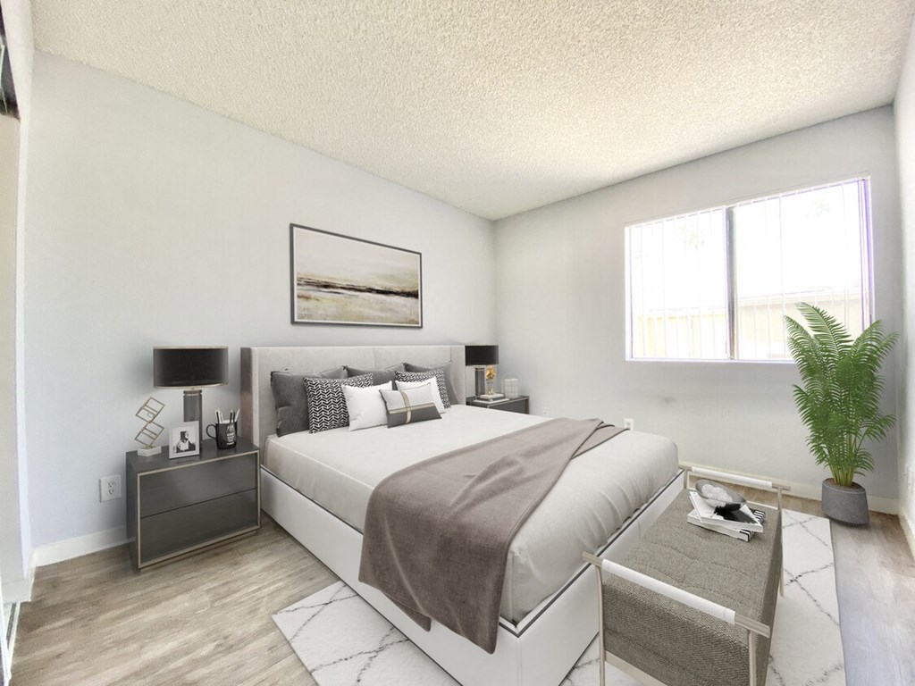 a bedroom with a bed and a window