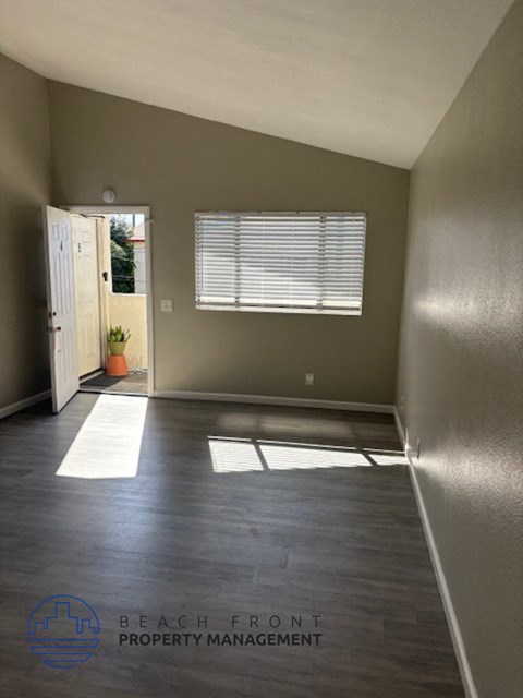 an empty empty room with a door and a window