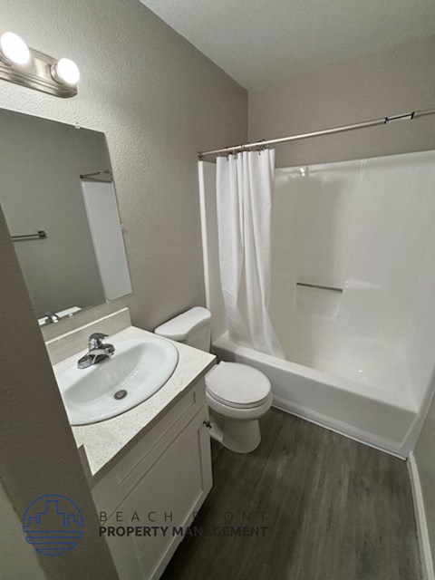 a bathroom with a sink toilet and a shower