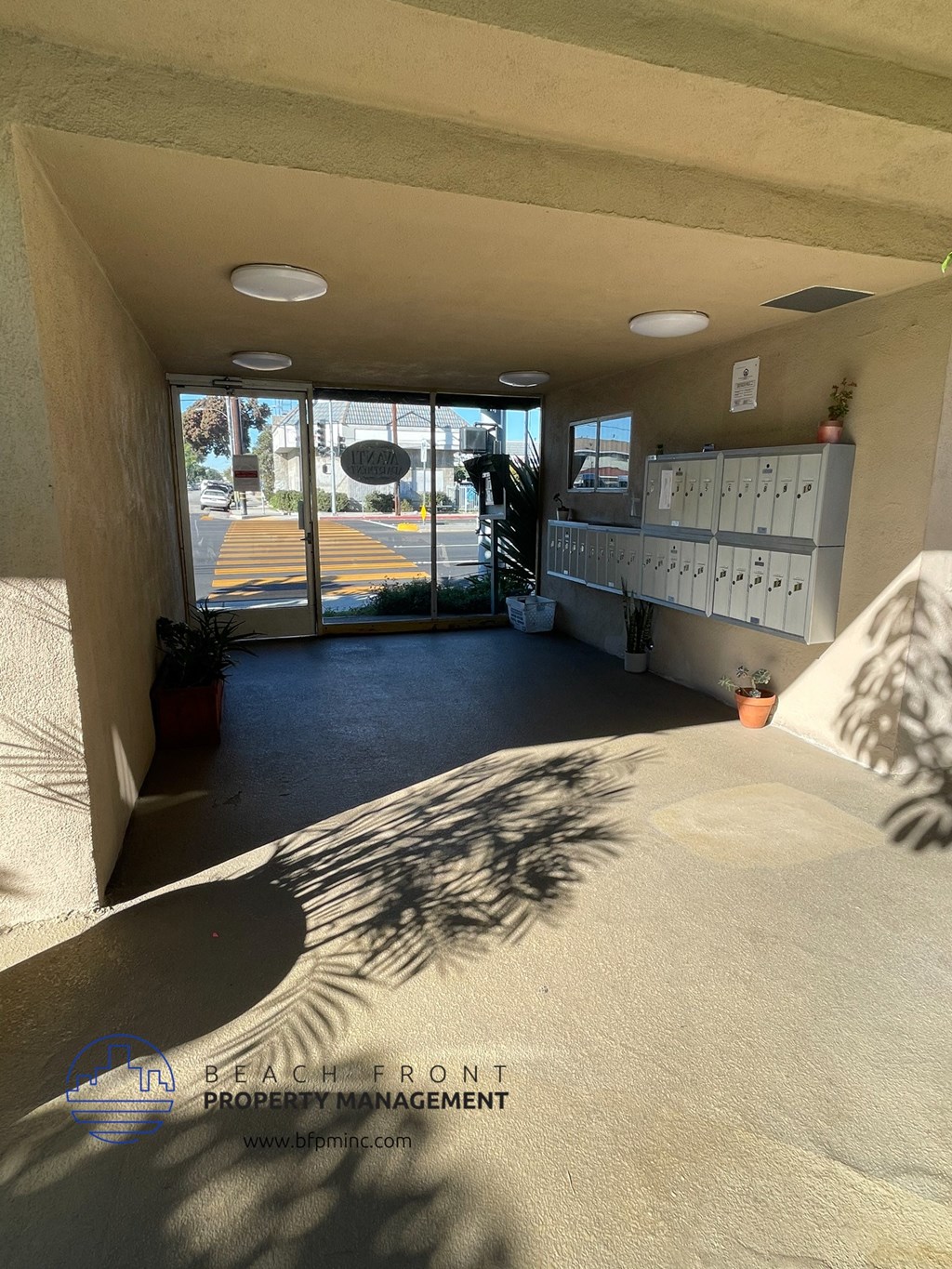 a view of the inside of a building from the entrance of a classroom