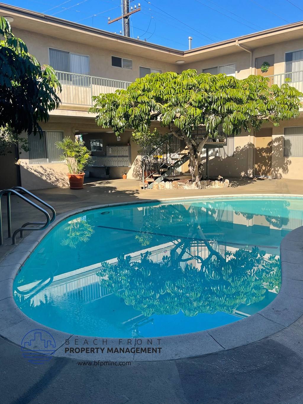 the swimming pool at the beachfront property management