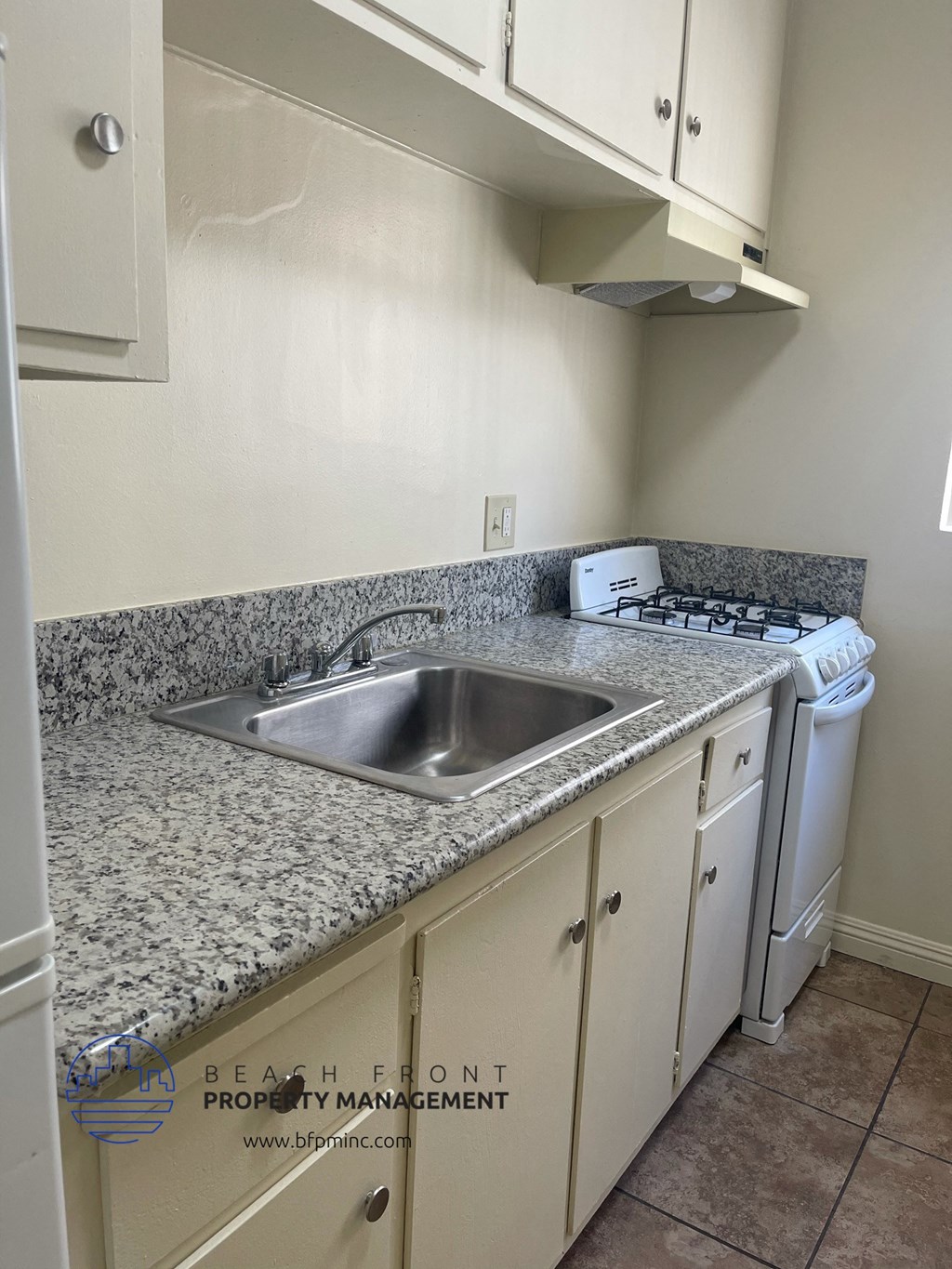 a kitchen with granite counter tops and a sink