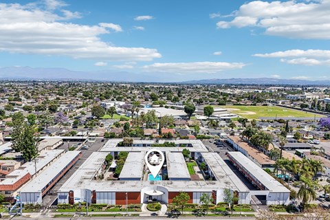 A large industrial building with a circular logo on the front.
