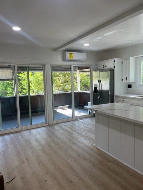 an empty kitchen with sliding glass doors to a patio