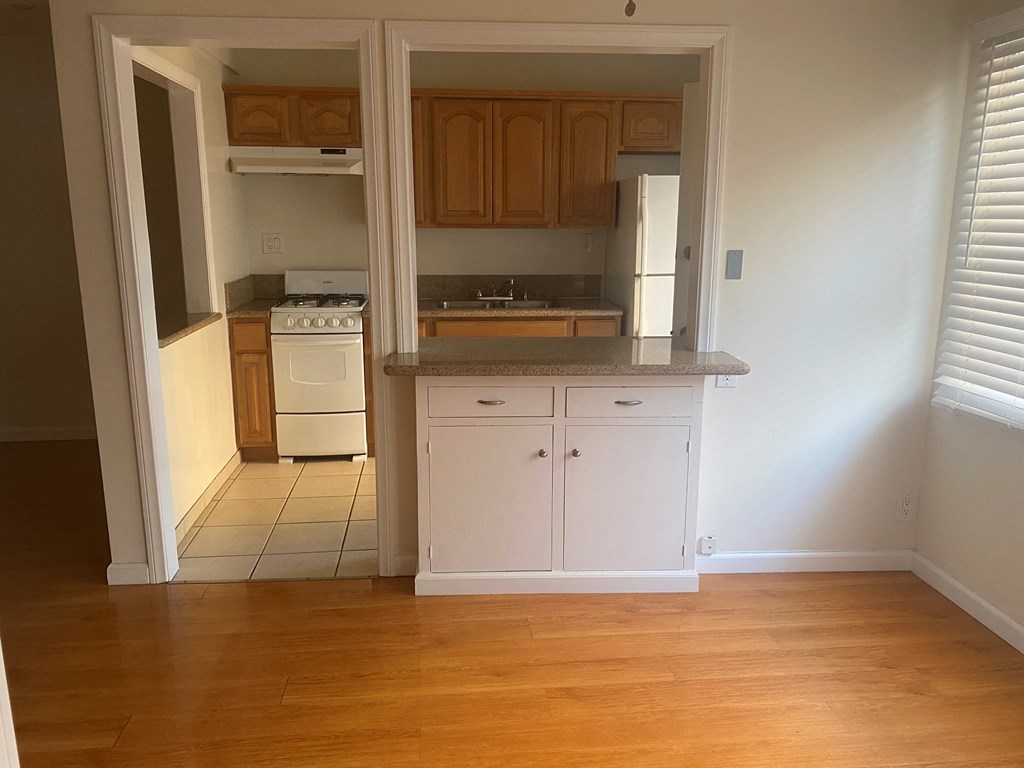 a view of a kitchen from the living room