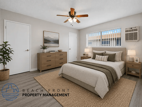 A bedroom with a bed, dresser, and ceiling fan.