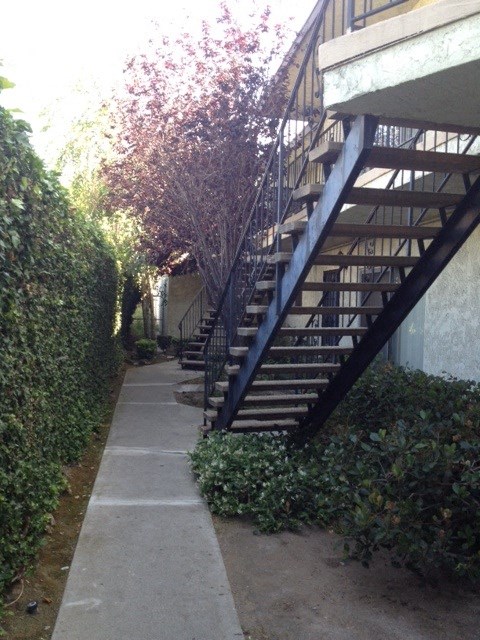 the stairs to the condos are next to the sidewalk