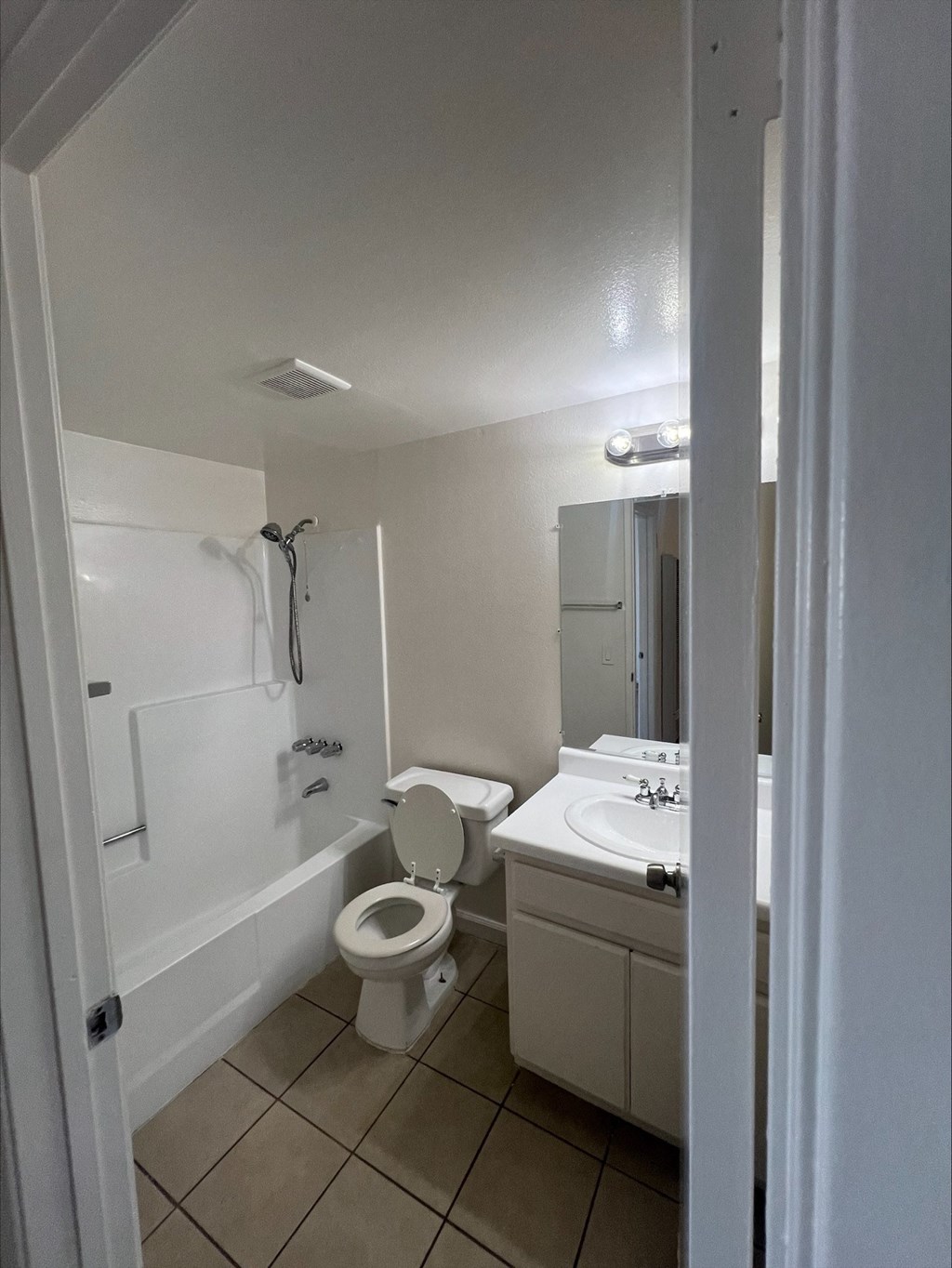 a bathroom with a toilet and a sink and a bath tub