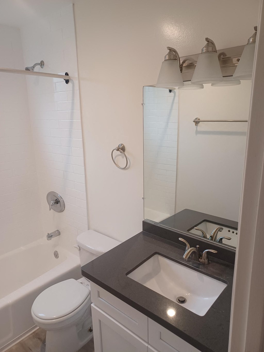 a small bathroom with a sink toilet and shower