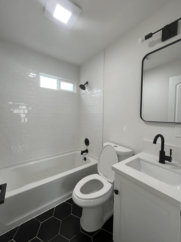 a bathroom with a toilet sink and bathtub