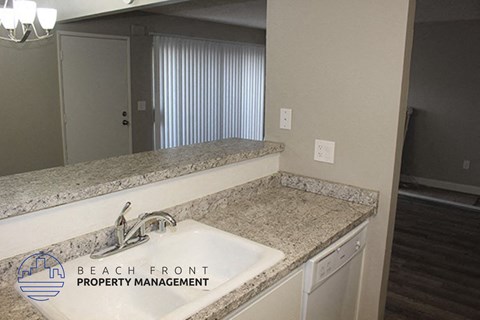 a kitchen with granite counter tops and a sink