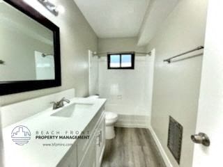 a bathroom with a sink and a mirror and a toilet