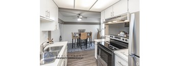 A modern kitchen with a dining table set up.