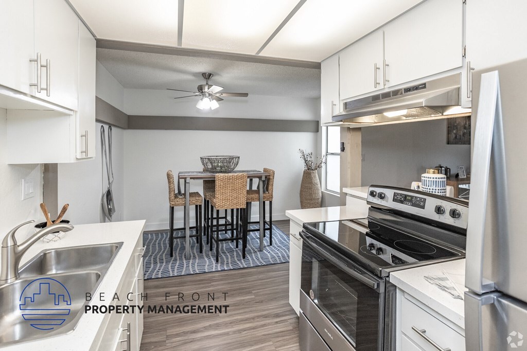 A modern kitchen with a dining table set up.