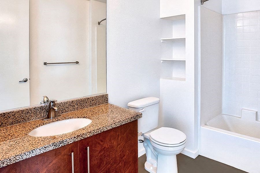 a bathroom with a sink toilet and a shower