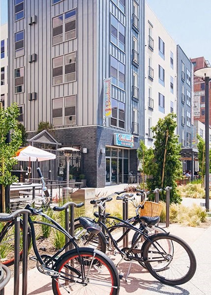 a group of bikes parked in front of a building