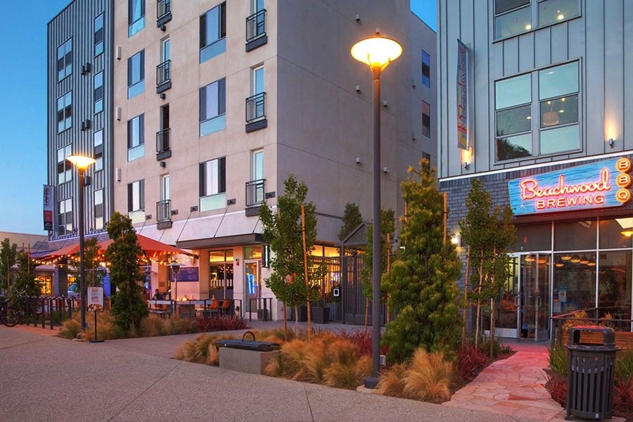 an exterior view of a building with a restaurant and a street light