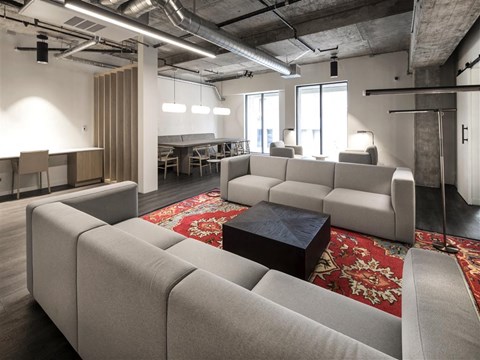a large living room with couches and a coffee table