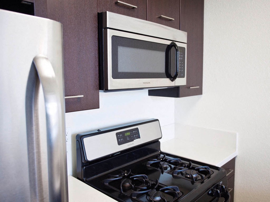 a kitchen with a stove and a microwave