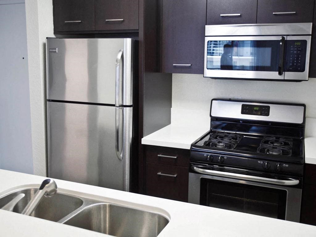 a kitchen with stainless steel appliances and a sink