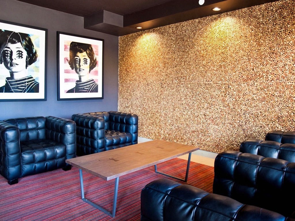 a living room with leather chairs and a table