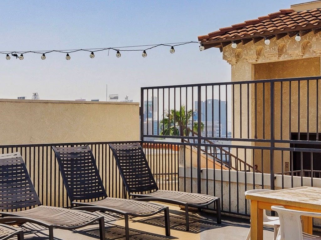 a group of chairs sitting on top of a balcony