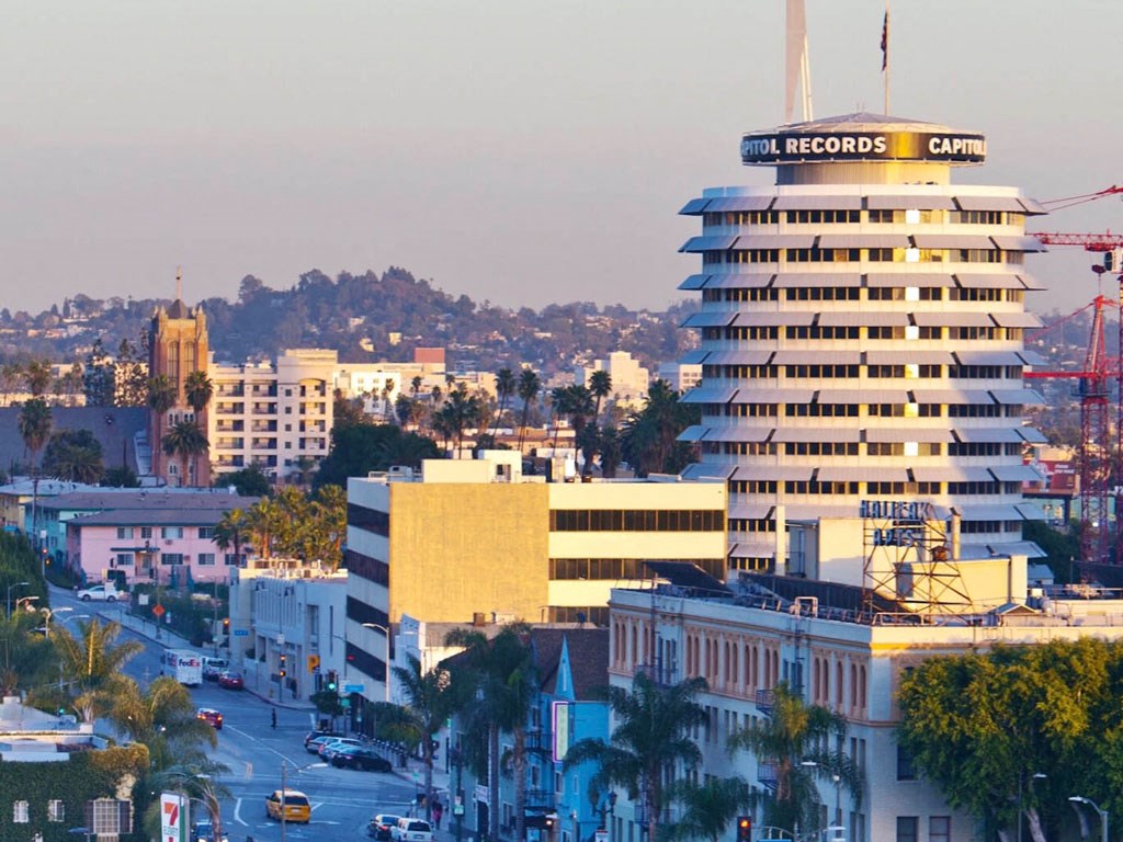 a view of a city with a tall building     and a city