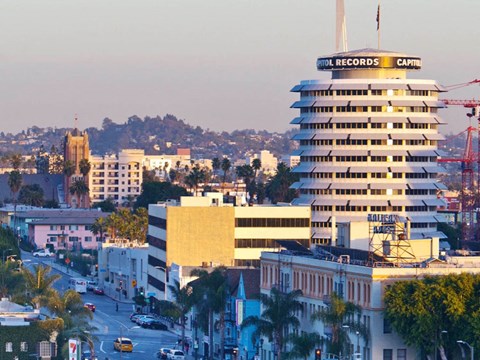 a view of a city with a tall building     and a city