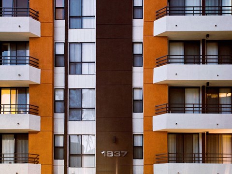 a row of apartment buildings with windows and balconies