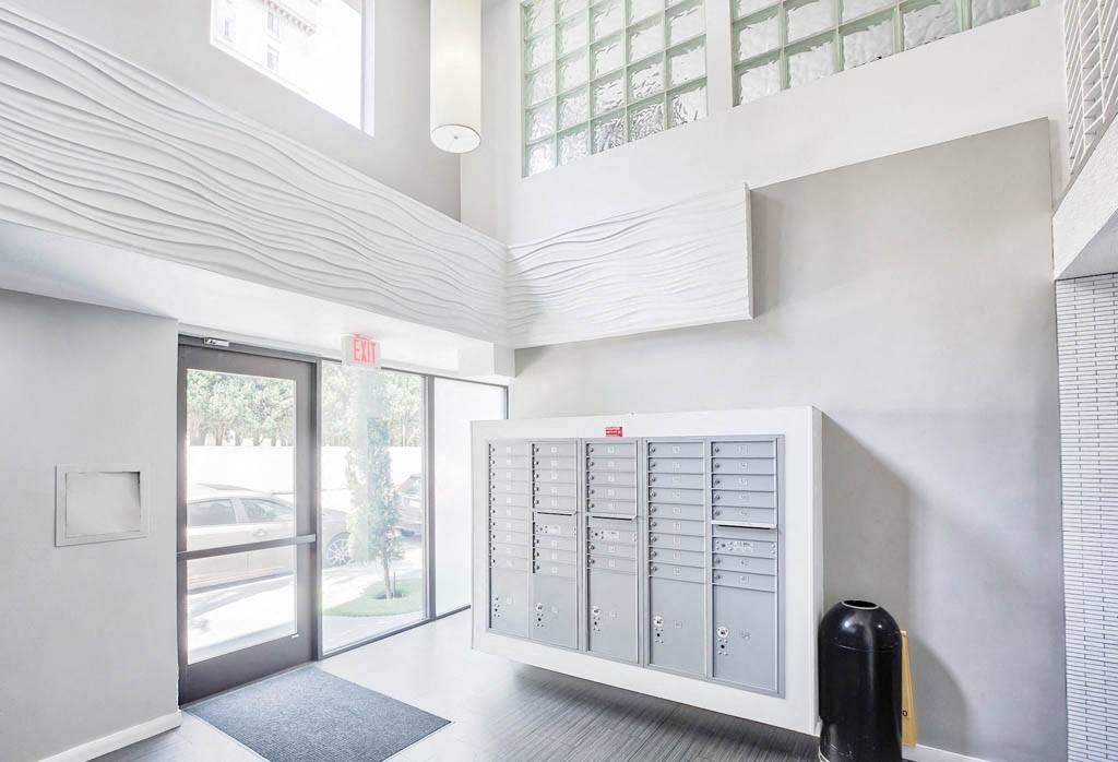 a view of a building with mailboxes on the wall