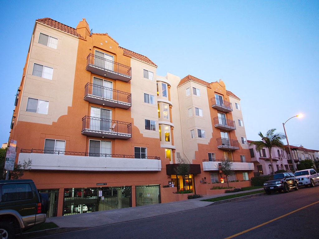 a view of an apartment building on a city street